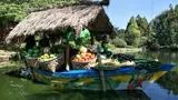 ID: Perahu pajangan buah dan sayuran di Floating Market Lembang, Kabupaten Bandung Barat. EN: A display boat with fruit and vegetables at Floating Market Lembang, West Bandung Regency.