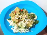 Seporsi miedes di piring biru dengan sayuran dan irisan mentimun / A plate of miedes with vegetables and sliced cucumber